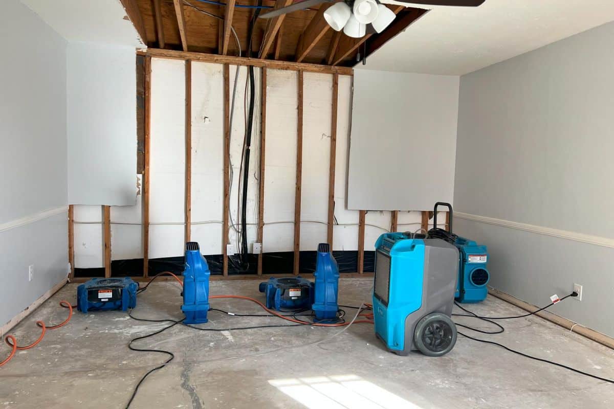 Professional water damage restoration team with drying equipment working in an Atlanta home